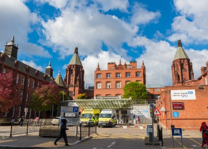 Outside the front of the NHS Birmingham Children's Hospital, accompanied by two parked ambulances